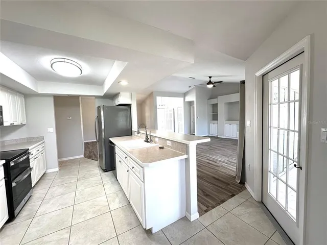 a large kitchen with a large window