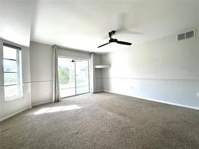 a view of empty room with windows