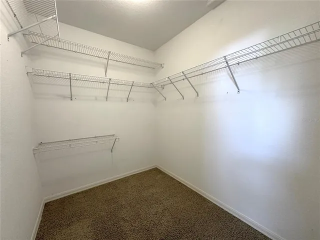 a view of a room with racks on the wall