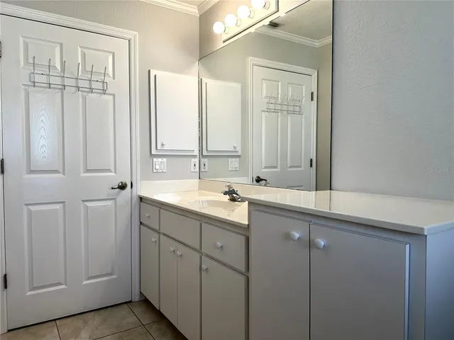 a bathroom with a double vanity sink and a bathtub
