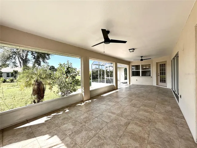 a view of an entryway with wooden floor and door