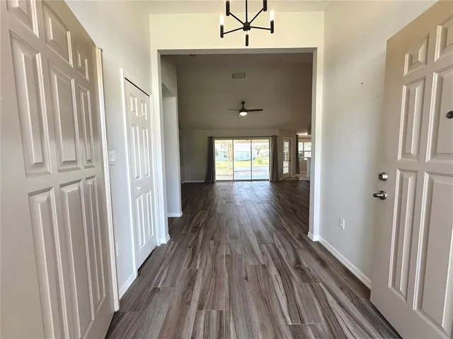 a view of gallery with wooden floor