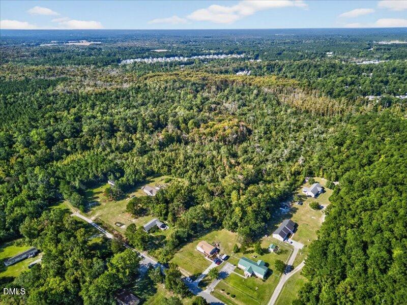 110 Hewett-Burton Road Southeast Leland, NC 28451 - Photo 12 of 27 a view of a lush green forest with a houses