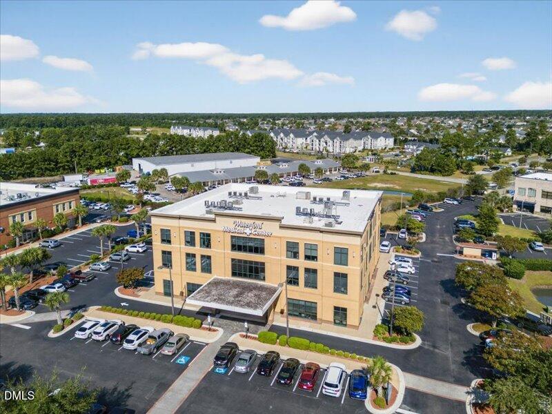 110 Hewett-Burton Road Southeast Leland, NC 28451 - Photo 17 of 27 a view of a city that has tall buildings