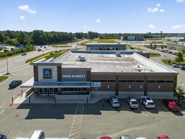 a view of a balcony with two chairs and a table