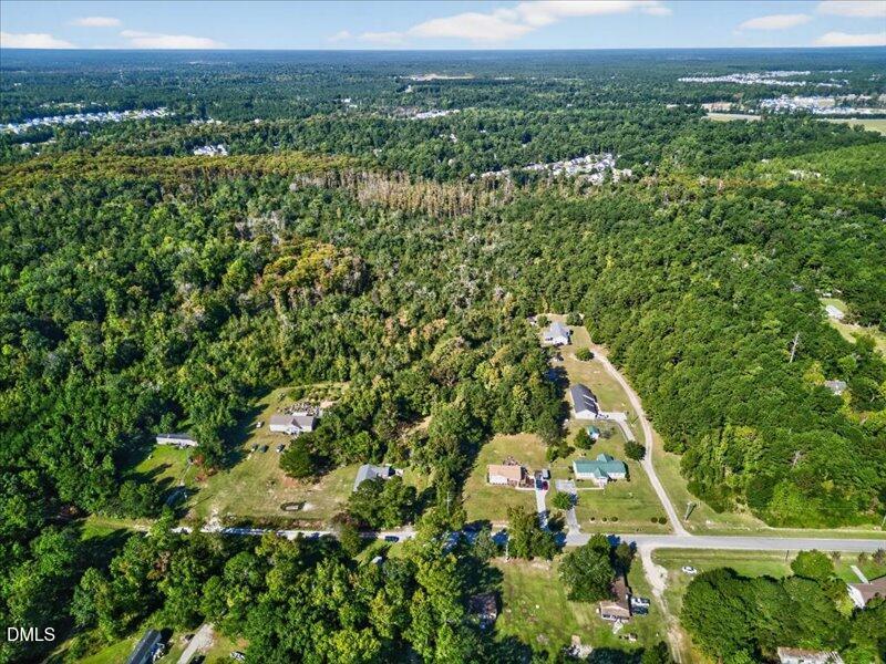 110 Hewett-Burton Road Southeast Leland, NC 28451 - Photo 8 of 27 an aerial view of residential houses with outdoor space and trees