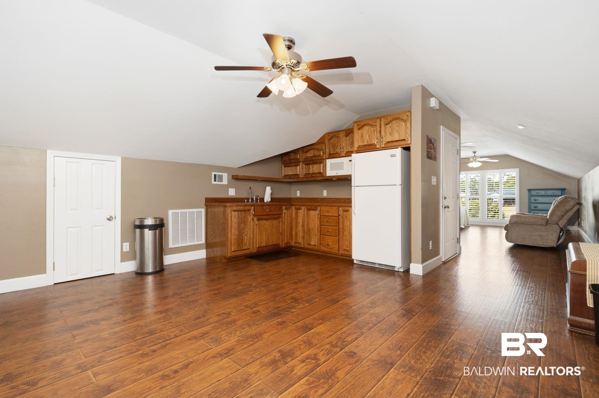 15025 Bellingrath Road Coden, AL 36523 - Photo 79 of 79 Kitchen with open floor plan, white appliances, wood finish cabinetry, a ceiling fan, and dark wood finished floors