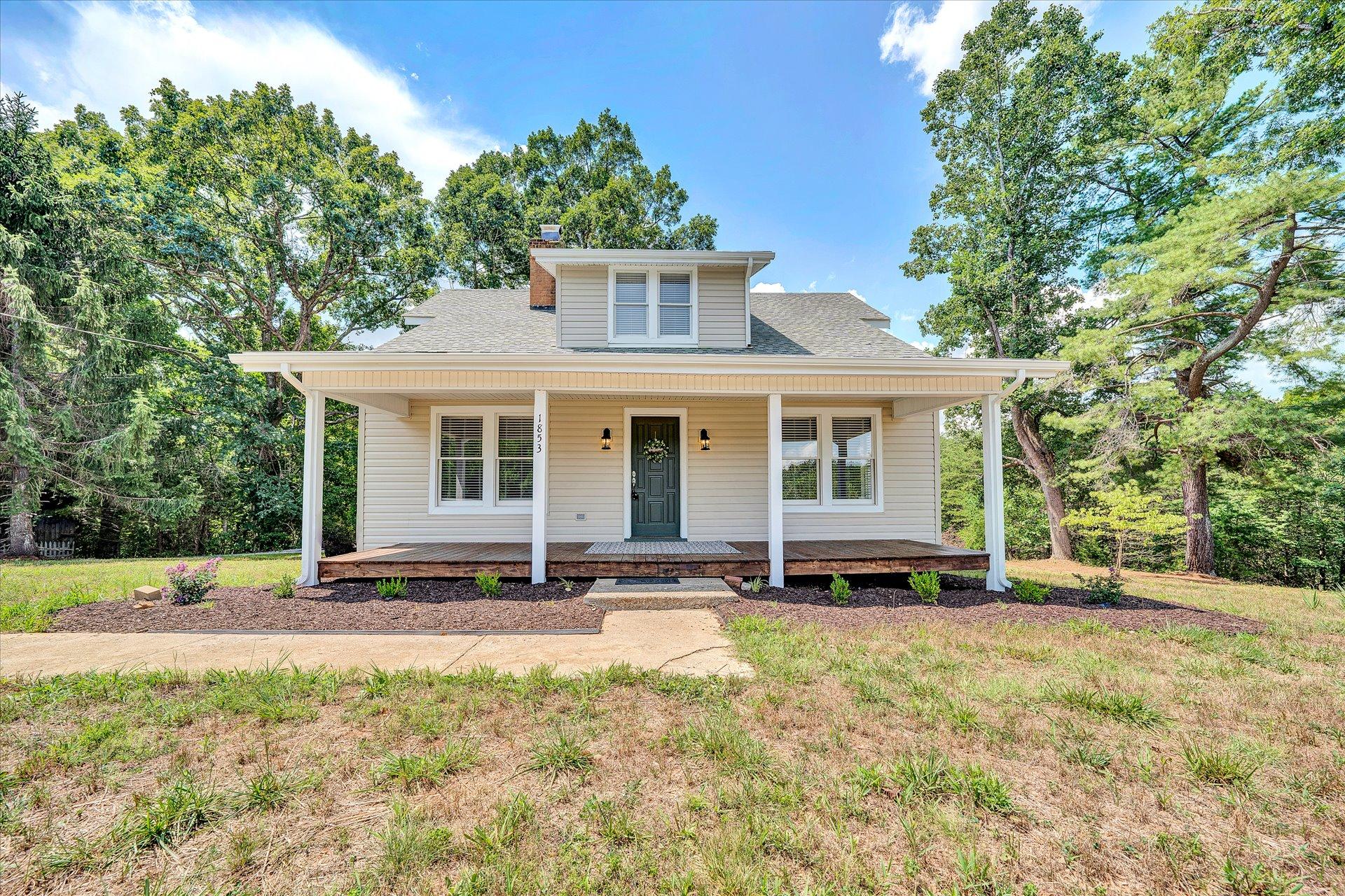 1853 Navigation Point Goodview, VA 24095 - Photo 1 of 38 a front view of a house with a garden