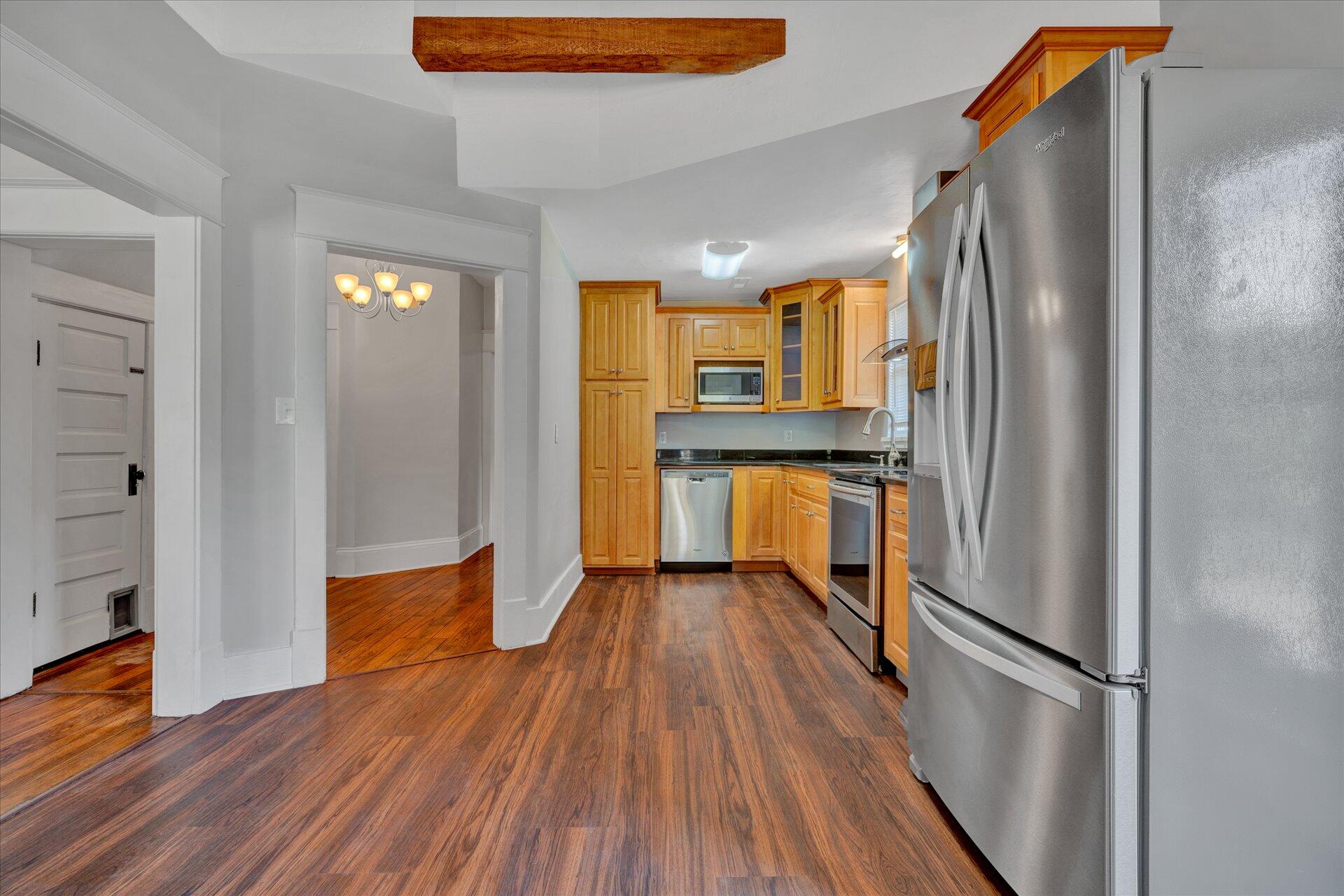 1853 Navigation Point Goodview, VA 24095 - Photo 14 of 38 a kitchen with stainless steel appliances a refrigerator and wooden floor