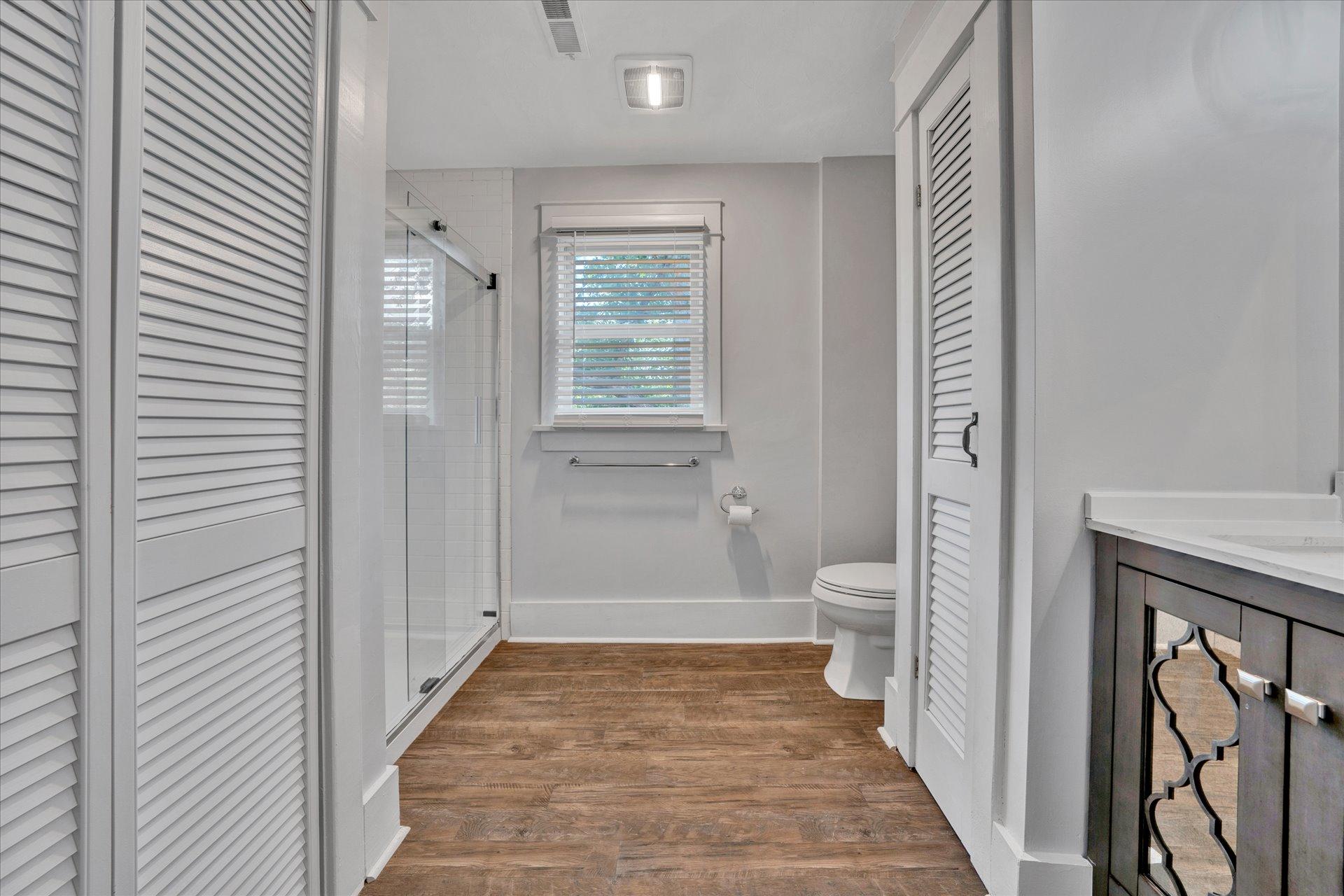 1853 Navigation Point Goodview, VA 24095 - Photo 21 of 38 a bathroom with a granite countertop toilet a sink and a mirror