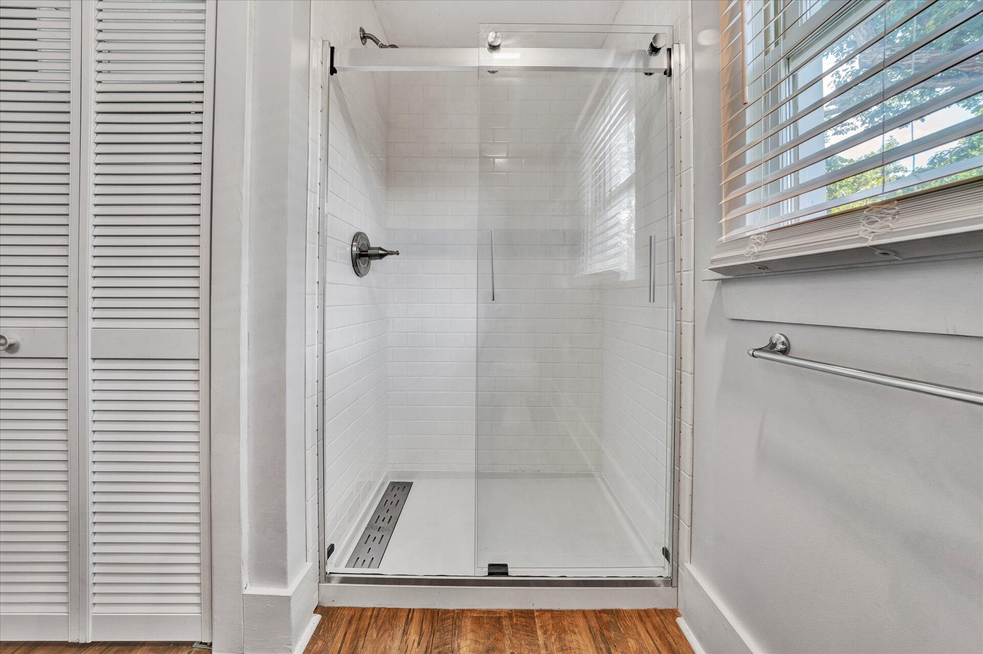 1853 Navigation Point Goodview, VA 24095 - Photo 23 of 38 a bathroom with a glass shower door