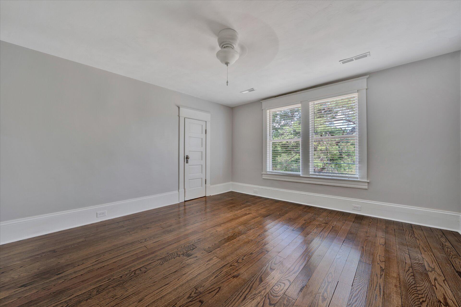 1853 Navigation Point Goodview, VA 24095 - Photo 31 of 38 a view of an empty room with wooden floor and a window