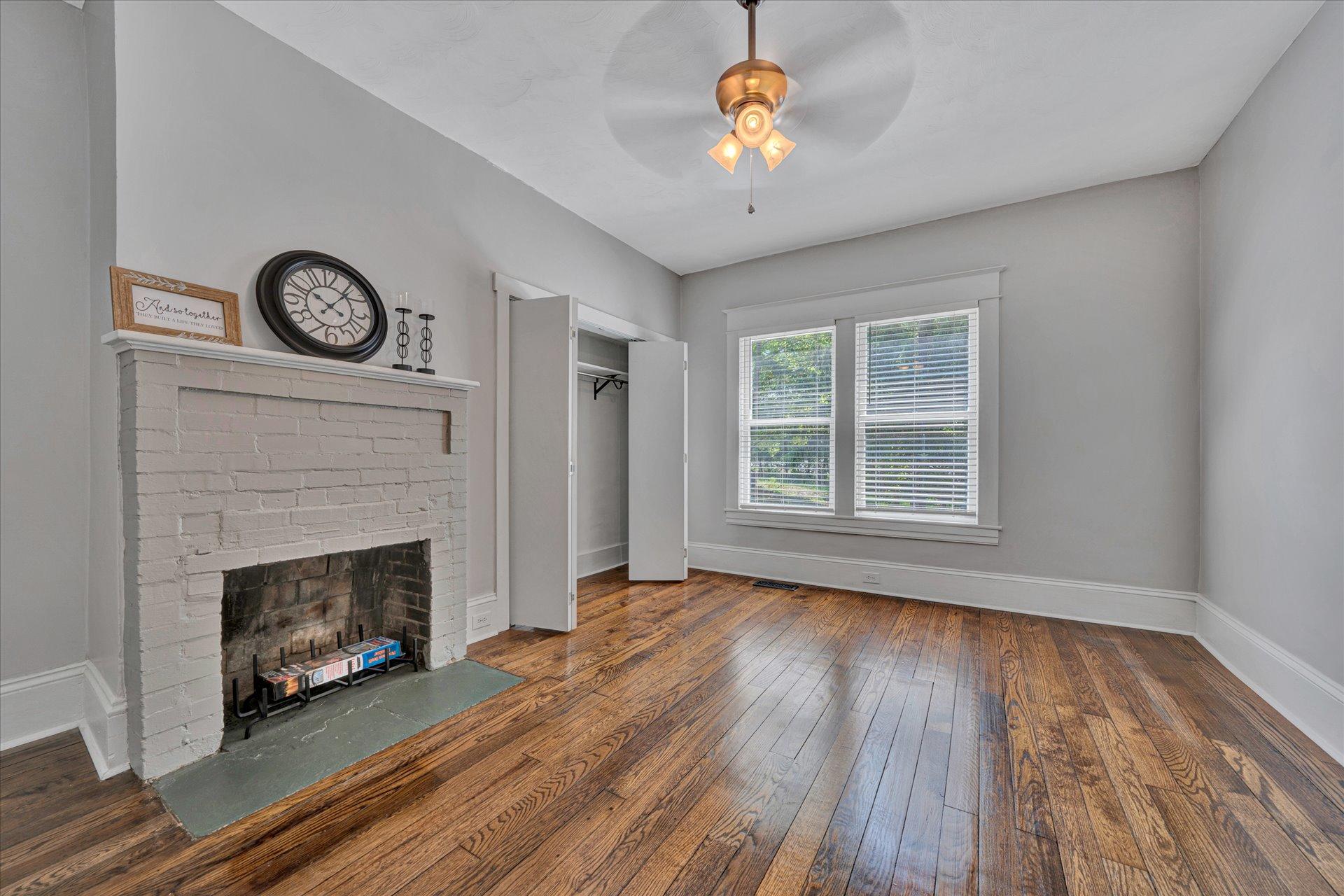 1853 Navigation Point Goodview, VA 24095 - Photo 7 of 38 a view of an empty room with a fireplace and wooden floor