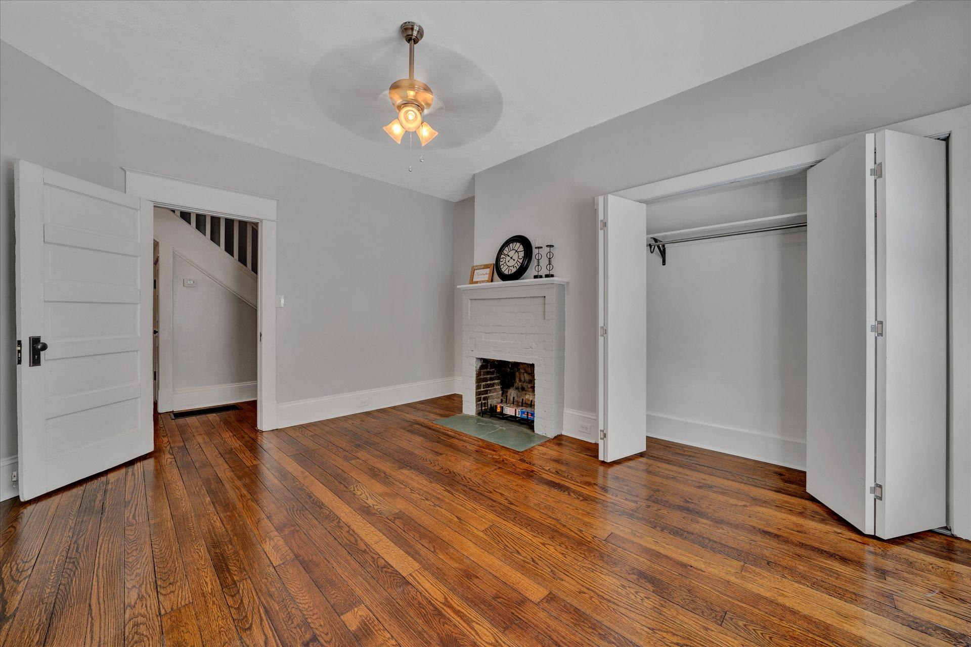 1853 Navigation Point Goodview, VA 24095 - Photo 10 of 38 a view of empty room with wooden floor and fireplace