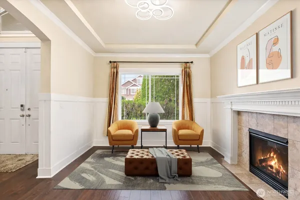 a dining room with furniture a rug and wooden floor