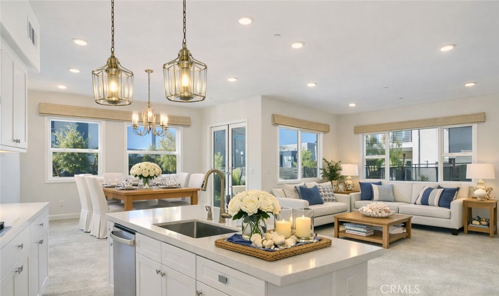 121 Baluster Irvine, CA 92618 - Photo 4 of 80 a living room with furniture chandelier and large windows