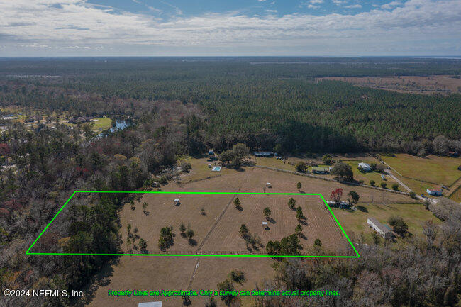 1895 Bennett Road St. Augustine, FL 32092 - Photo 17 of 17 an aerial view of a house with a yard