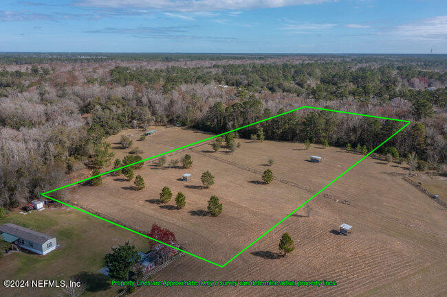 1895 Bennett Road St. Augustine, FL 32092 - Photo 2 of 17 an aerial view of a house with outdoor space