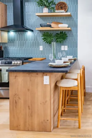 a kitchen with a table and chairs