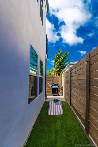 a front view of a house with a yard fountain and entertaining space