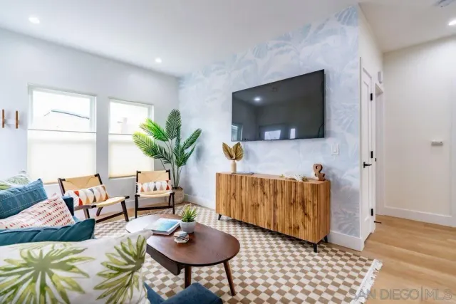 a living room with furniture and a flat screen tv