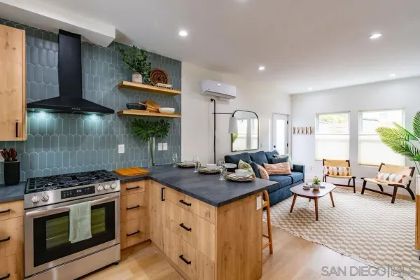 a kitchen with stainless steel appliances granite countertop a stove and a sink