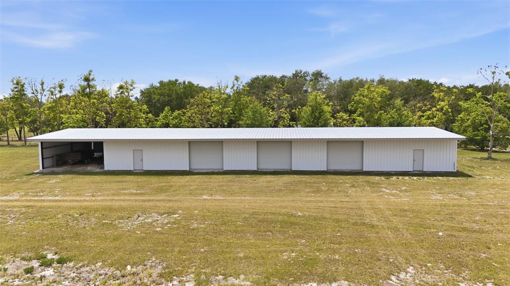 14433 Lake Yale Road Umatilla, FL 32784 - Photo 34 of 38 a view of a large pool with an outdoor space and seating area
