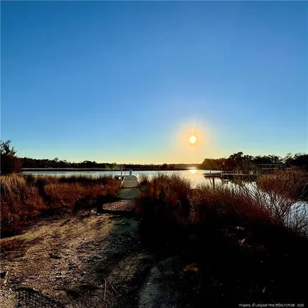 a view of lake with green space