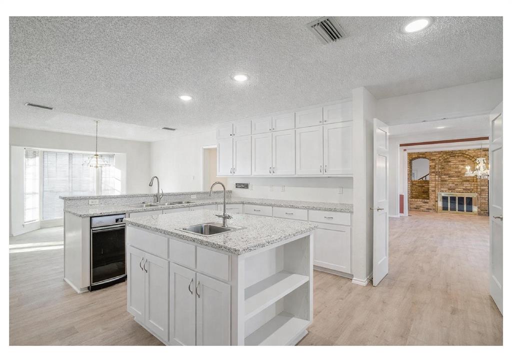 3017 Freeman Lane Crowley, TX 76036 - Photo 23 of 39 a kitchen with a sink stove and cabinets