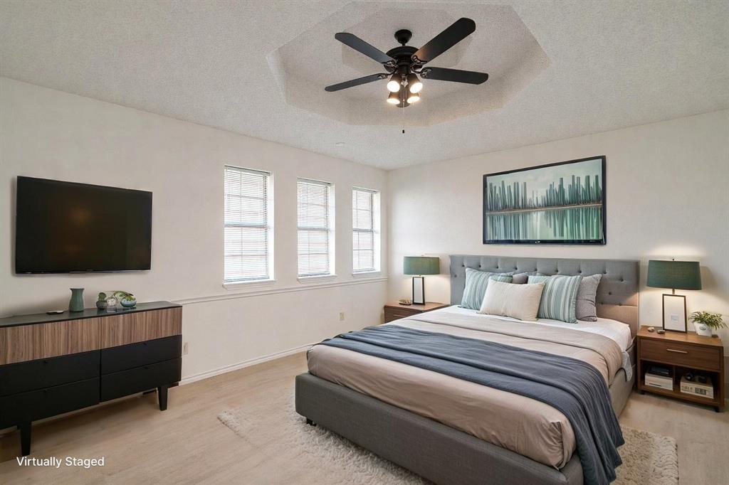 3017 Freeman Lane Crowley, TX 76036 - Photo 26 of 39 a bedroom with a large bed and a flat screen tv