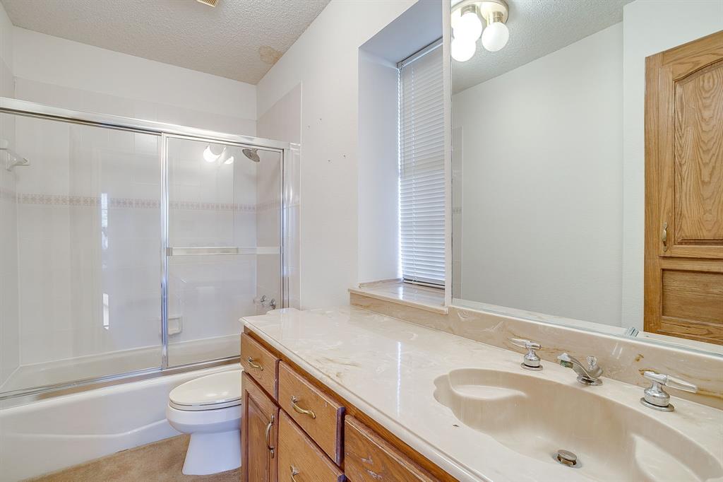 3017 Freeman Lane Crowley, TX 76036 - Photo 30 of 39 a bathroom with a sink and a mirror