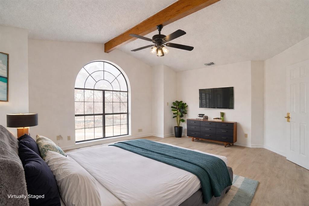 3017 Freeman Lane Crowley, TX 76036 - Photo 31 of 39 a bedroom with a bed and a flat screen tv