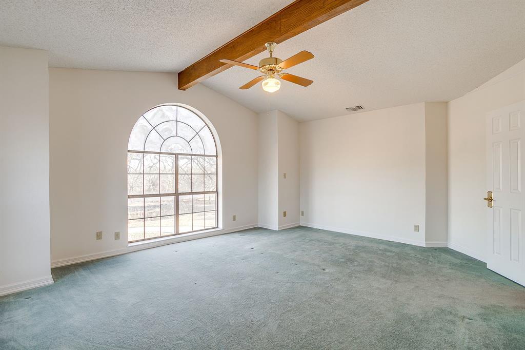 3017 Freeman Lane Crowley, TX 76036 - Photo 32 of 39 an empty room with windows and ceiling fan