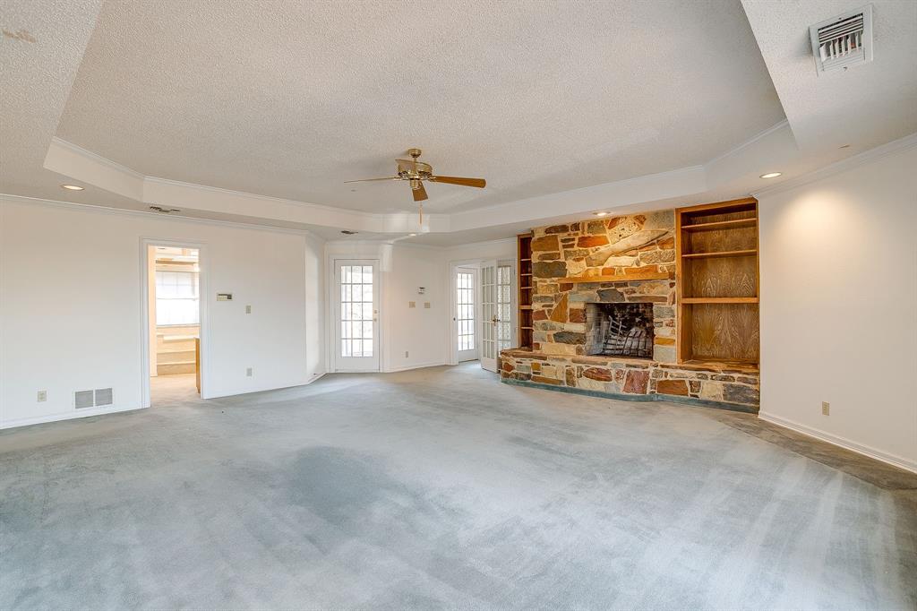 3017 Freeman Lane Crowley, TX 76036 - Photo 36 of 39 an empty room with a fireplace and sliding door