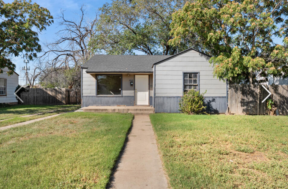 2614 36th Street Lubbock, TX 79413 - Photo 1 of 1 a front view of a house with a yard and garage