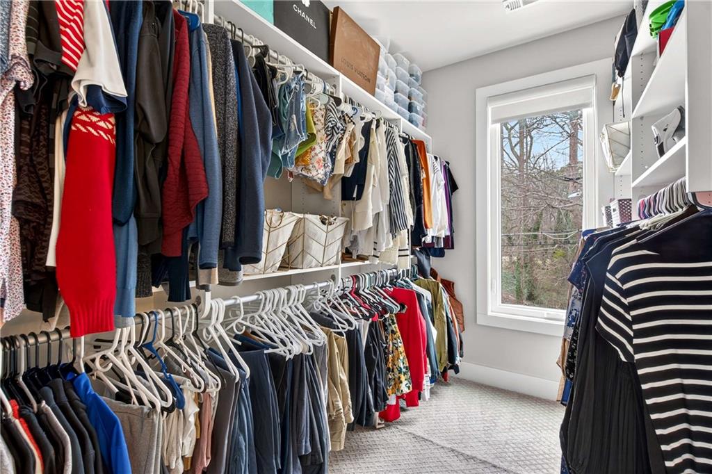 2974 Hermance Drive Northeast Atlanta, GA 30319 - Photo 24 of 38 a view of walk in closet with clothes