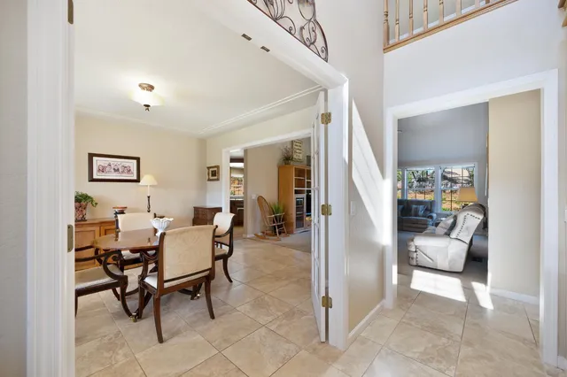 a dining room with furniture and window