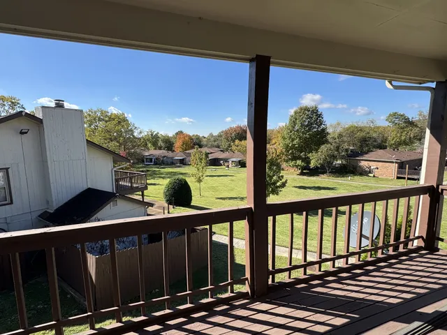 a balcony view with a garden space