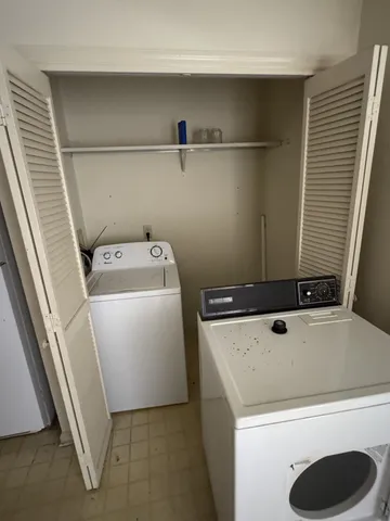 a white toilet sitting next to a bath tub