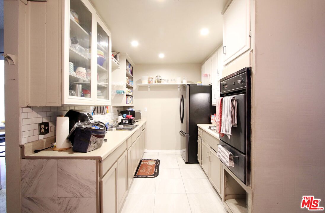 8820 Holly Lane Riverside, CA 92503 - Photo 13 of 20 a kitchen with refrigerator and window