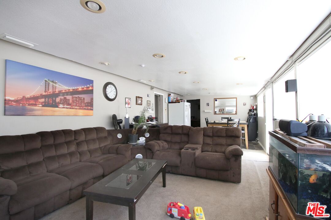 8820 Holly Lane Riverside, CA 92503 - Photo 18 of 20 a living room with furniture and a flat screen tv