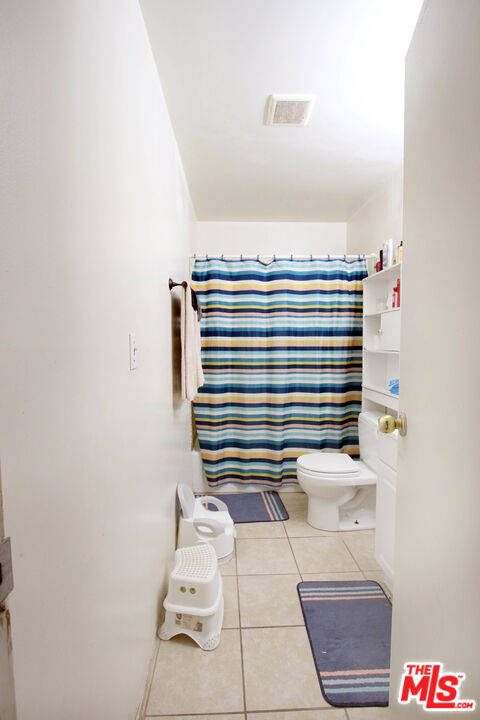 8820 Holly Lane Riverside, CA 92503 - Photo 19 of 20 a bathroom with a sink and a mirror