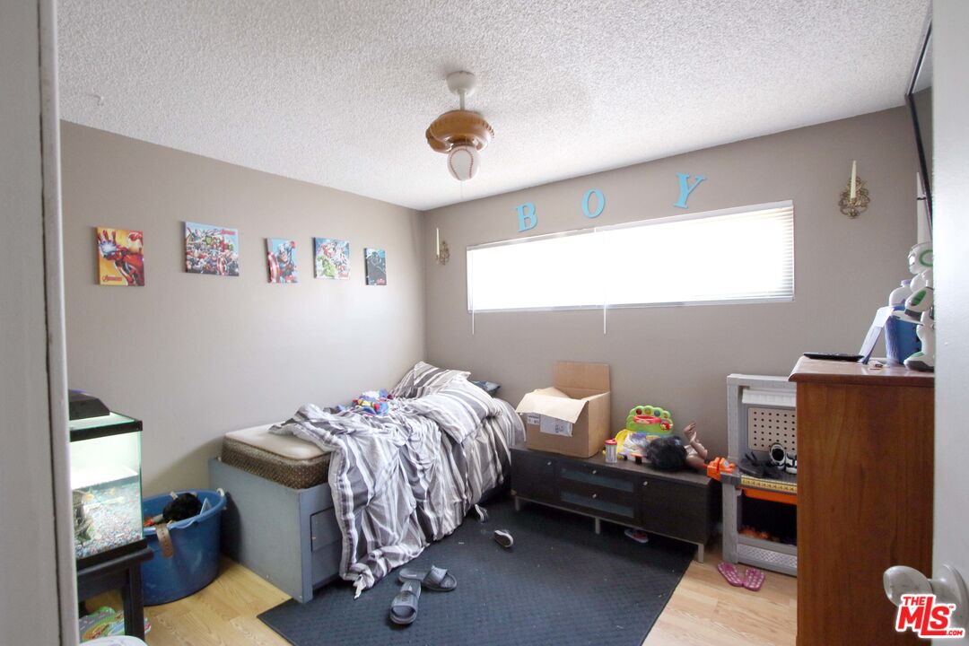 8820 Holly Lane Riverside, CA 92503 - Photo 6 of 20 a bedroom with furniture and a window