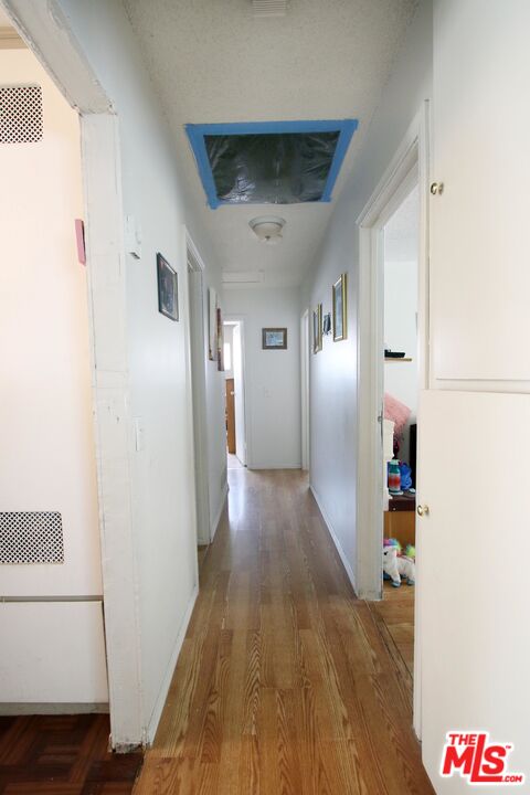 8820 Holly Lane Riverside, CA 92503 - Photo 7 of 20 a view of hallway with wooden floor