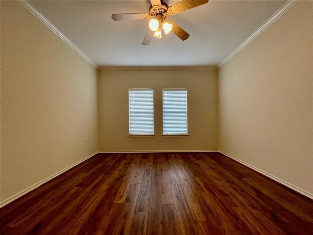 7505 Bell Isle Corpus Christi, TX 78414 - Photo 13 of 24 a view of an empty room with window and wooden floor