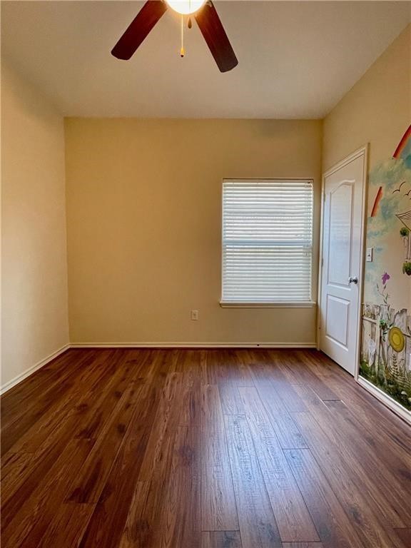 7505 Bell Isle Corpus Christi, TX 78414 - Photo 14 of 24 an empty room with wooden floor chandelier fan and windows