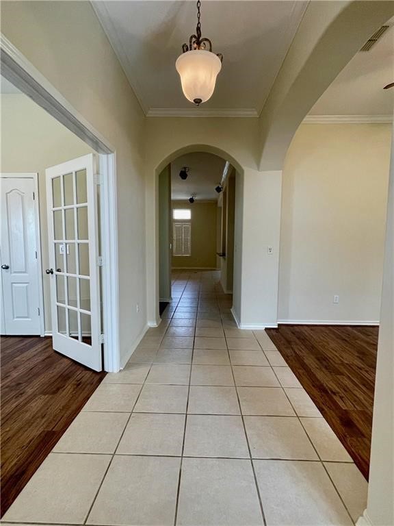 7505 Bell Isle Corpus Christi, TX 78414 - Photo 2 of 24 a view of a hallway with wooden floor and a chandelier