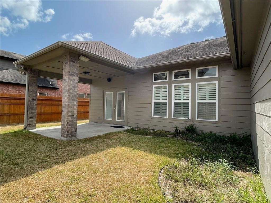 7505 Bell Isle Corpus Christi, TX 78414 - Photo 24 of 24 a front view of a house with a garden