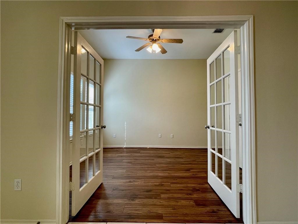 7505 Bell Isle Corpus Christi, TX 78414 - Photo 10 of 24 a view of a hallway with wooden floor and staircase