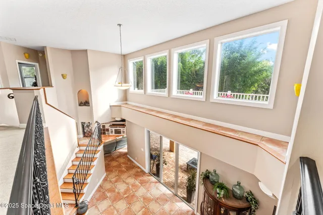 a spacious bedroom with a bed and a window